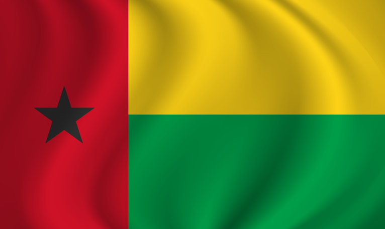 Guinea-Bissau waving flag blowing in the wind. Texture can be used as background. Vector illustration EPS10