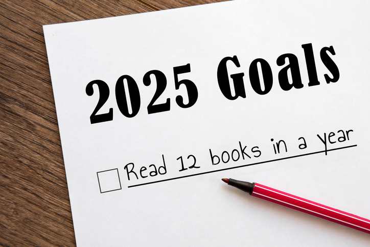 planner of goals and plans for 2025, a sheet of paper with text read 12 books in year from to do list. planning concept, New Year's resolutions plan.